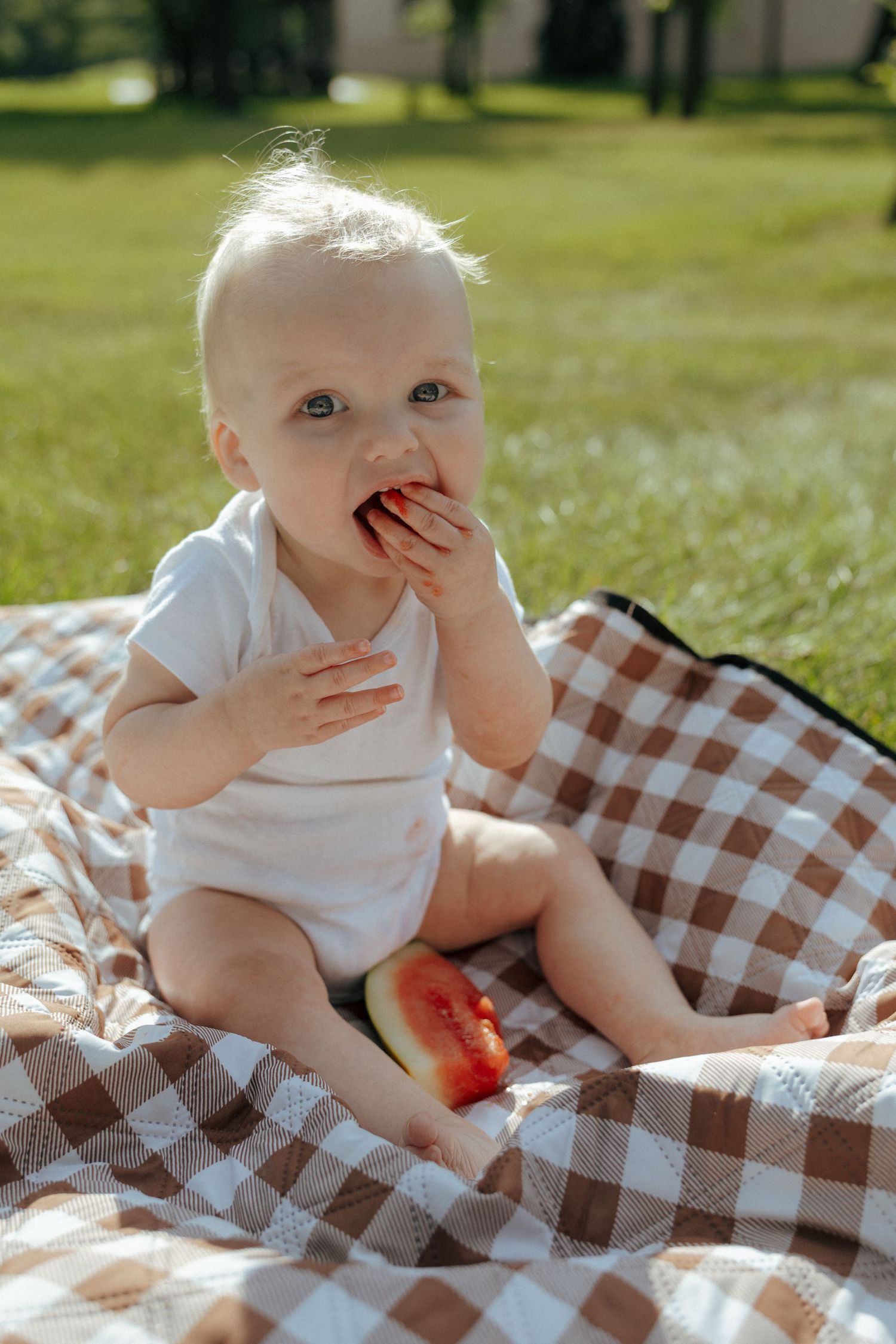 baby eating watermelon celebrating milestone