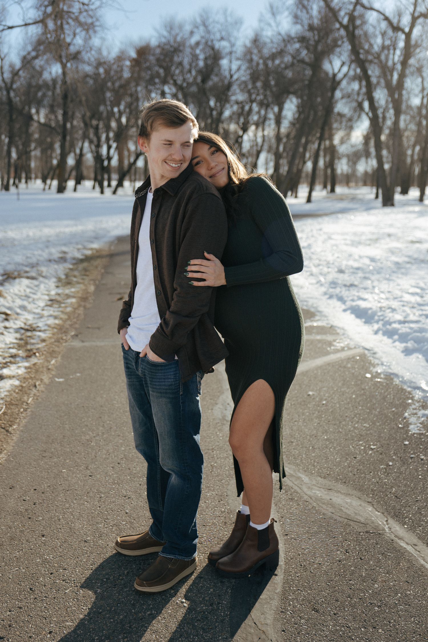 expecting couple in snowy park in Bismarck