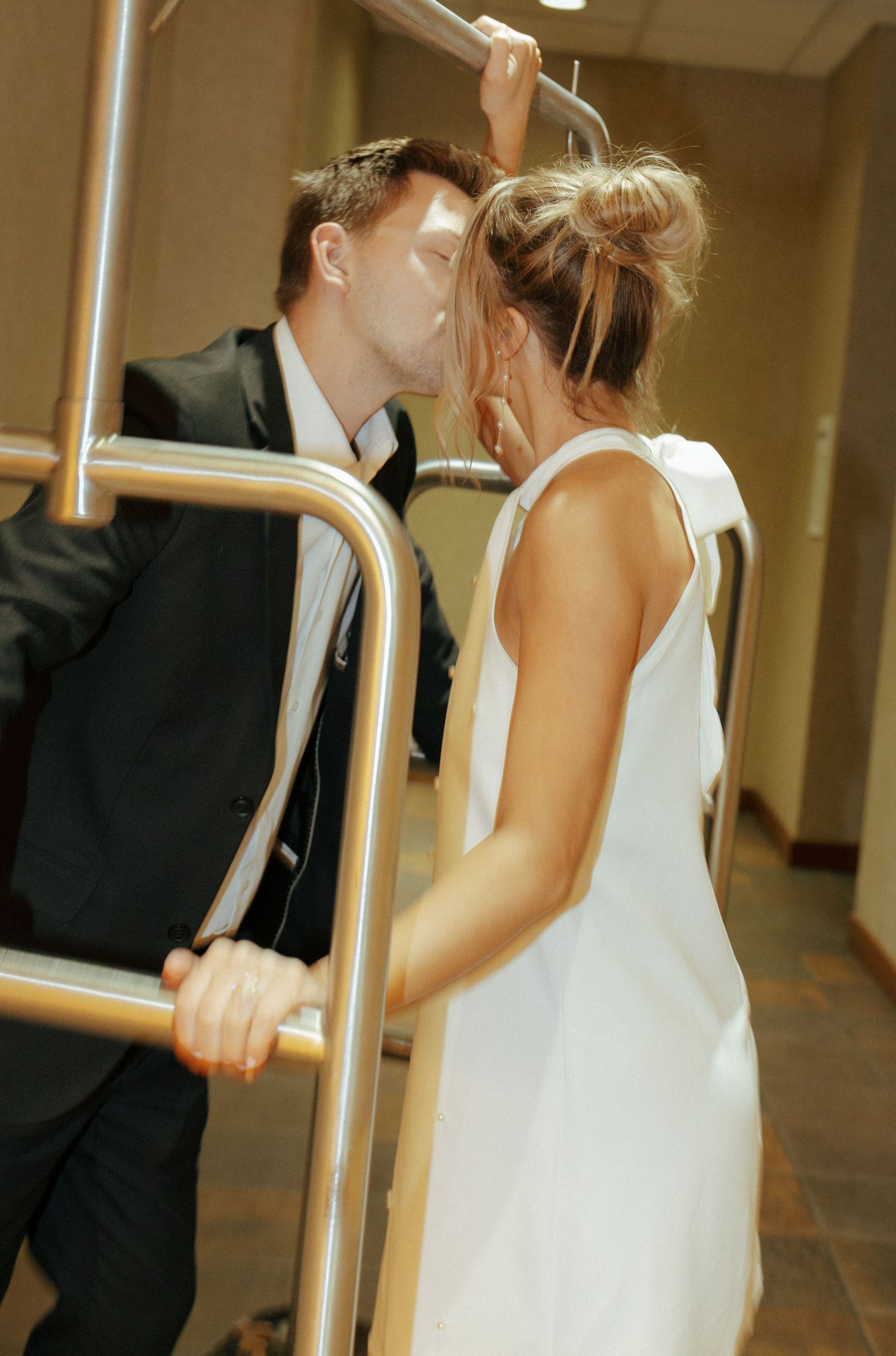 couple kissing for engagement photos in Bismarck