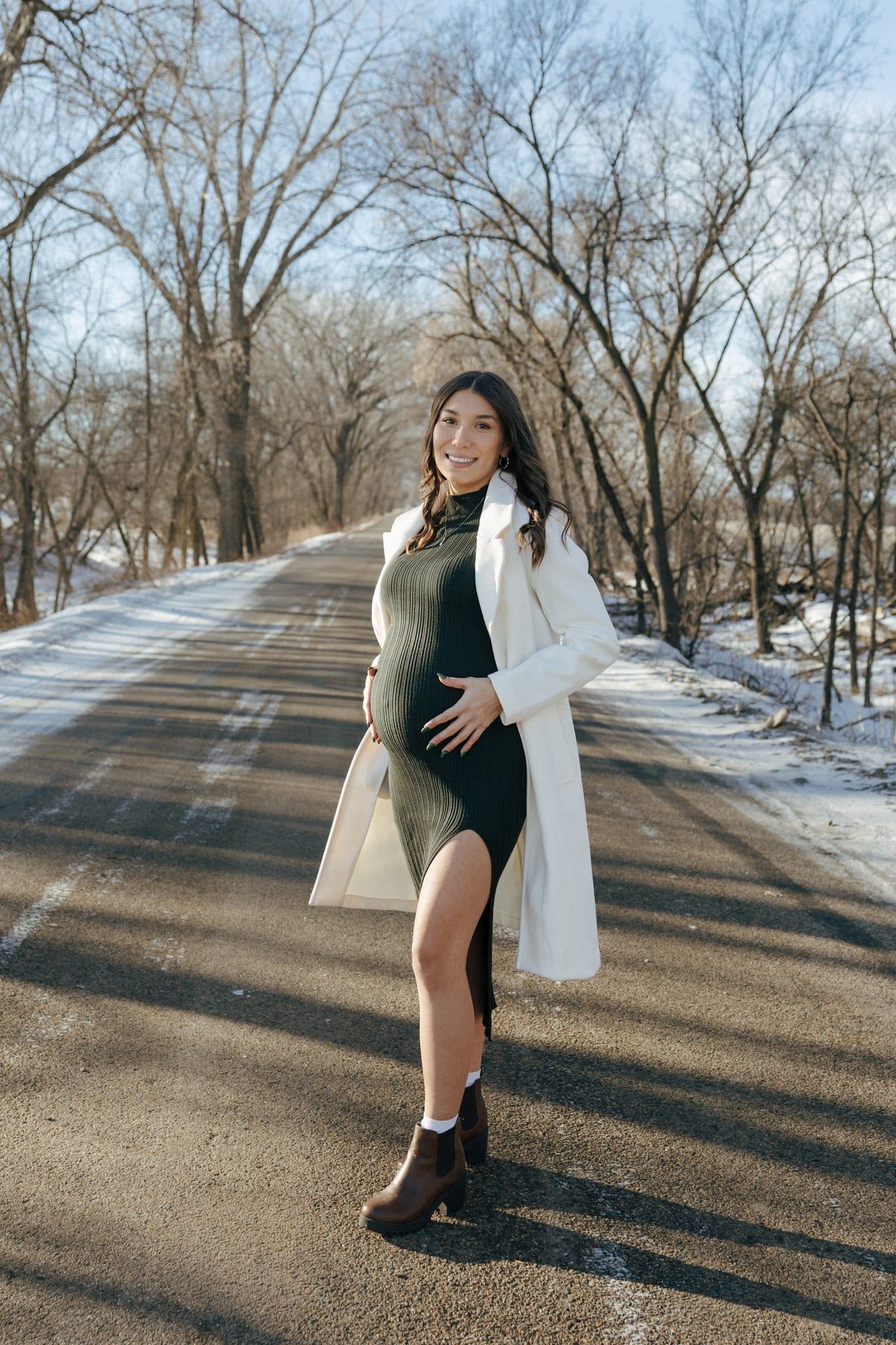 photos of mother to be in snowy trees in Bismarck