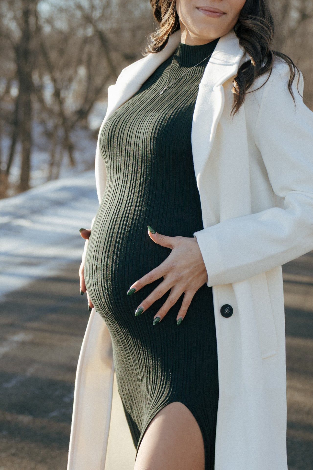 photos of mother to be in snowy trees in Bismarck