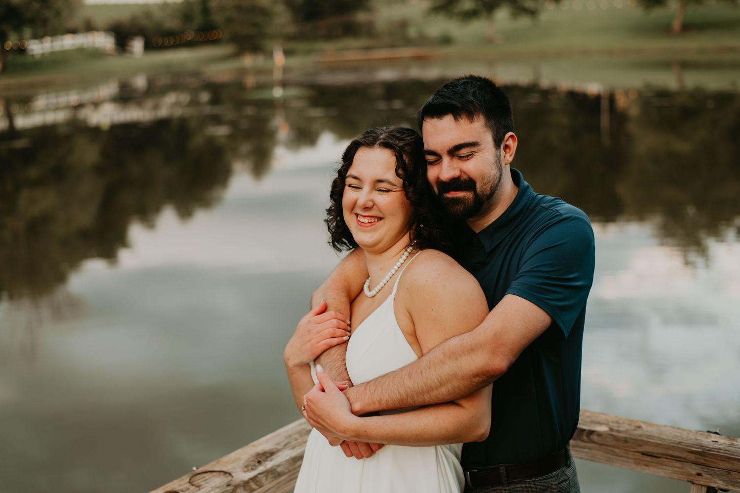 A romantic photo collection of a couple embracing by a serene lake setting during a tender moment together.