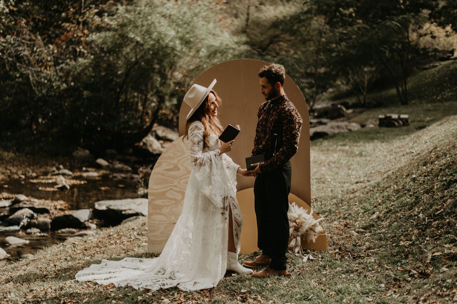 Outdoor wedding ceremony setup with arch against natural forest backdrop in Smoky Mountains.