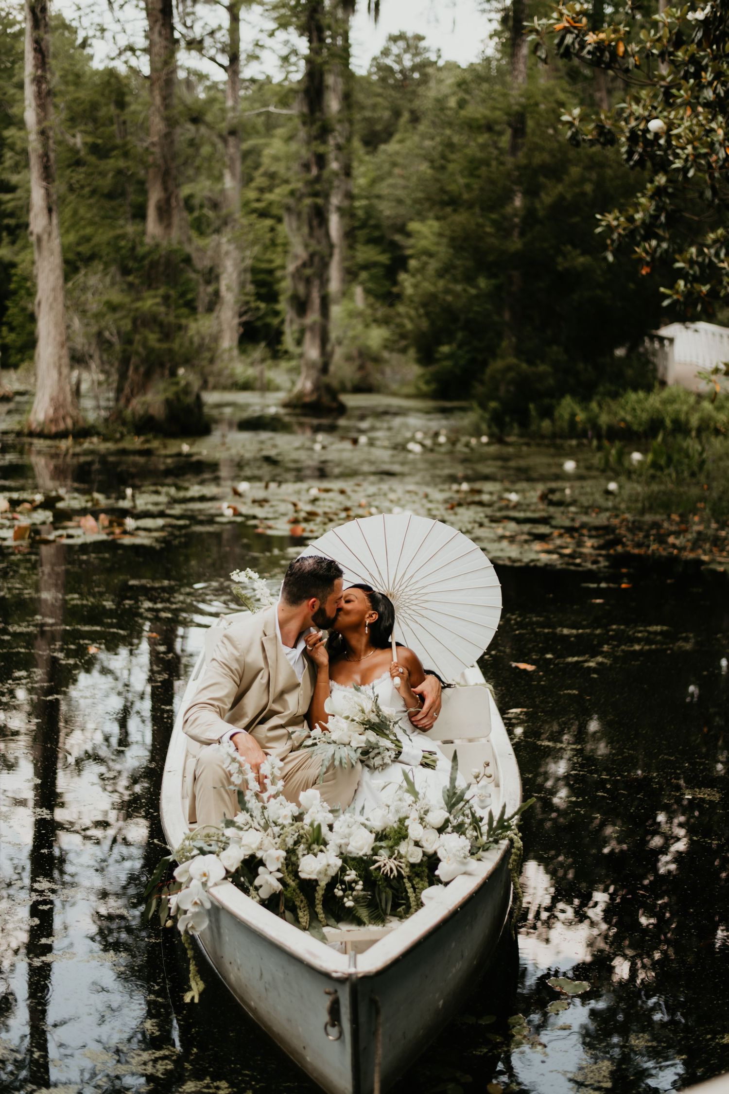 Intimate moment captured in a canoe on lily pad covered waters in Charleston South Carolina.