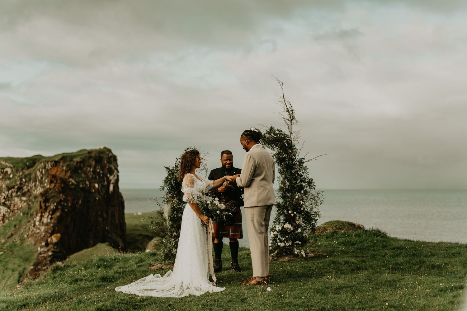 An intimate clifftop wedding ceremony overlooking the ocean in isle of skye Scotland.