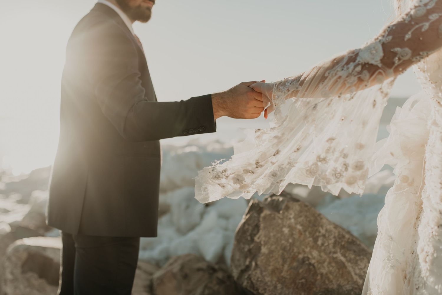 Dreamy sunlit moment captured during coastal wedding ceremony in Utah.