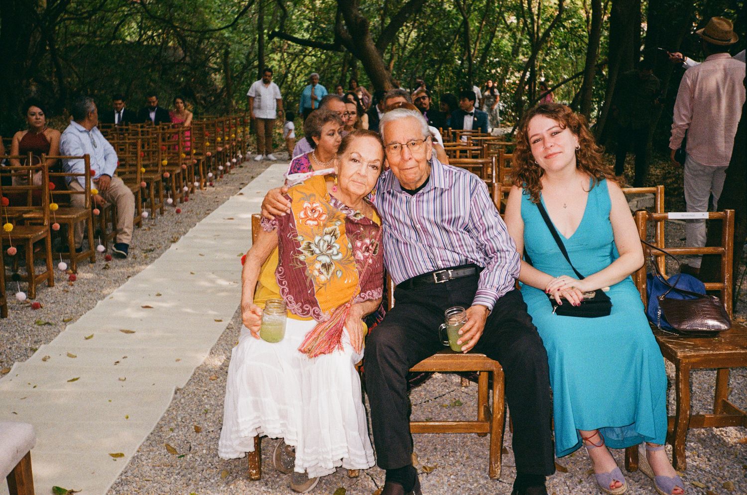 A group of people enjoying drinks and conversation at a casual outdoor gathering on a patio.