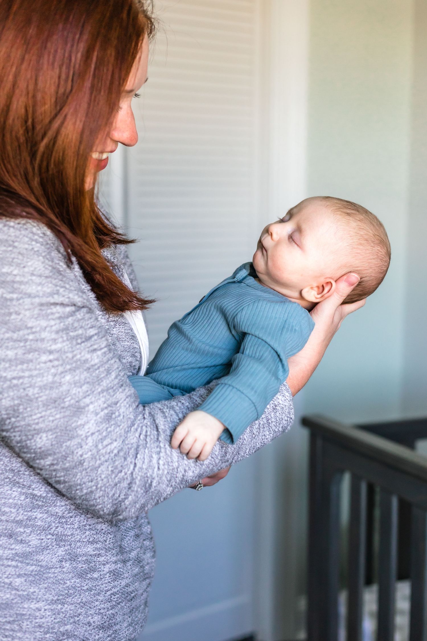 Sweet nurturing moment by a bright window.