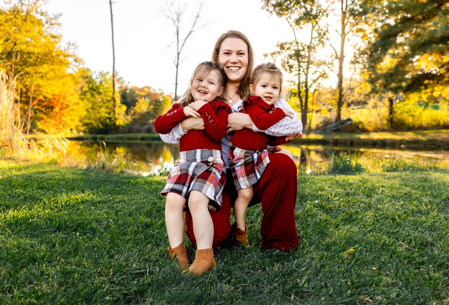 Playful outdoor family moment captured during golden hour in autumn.