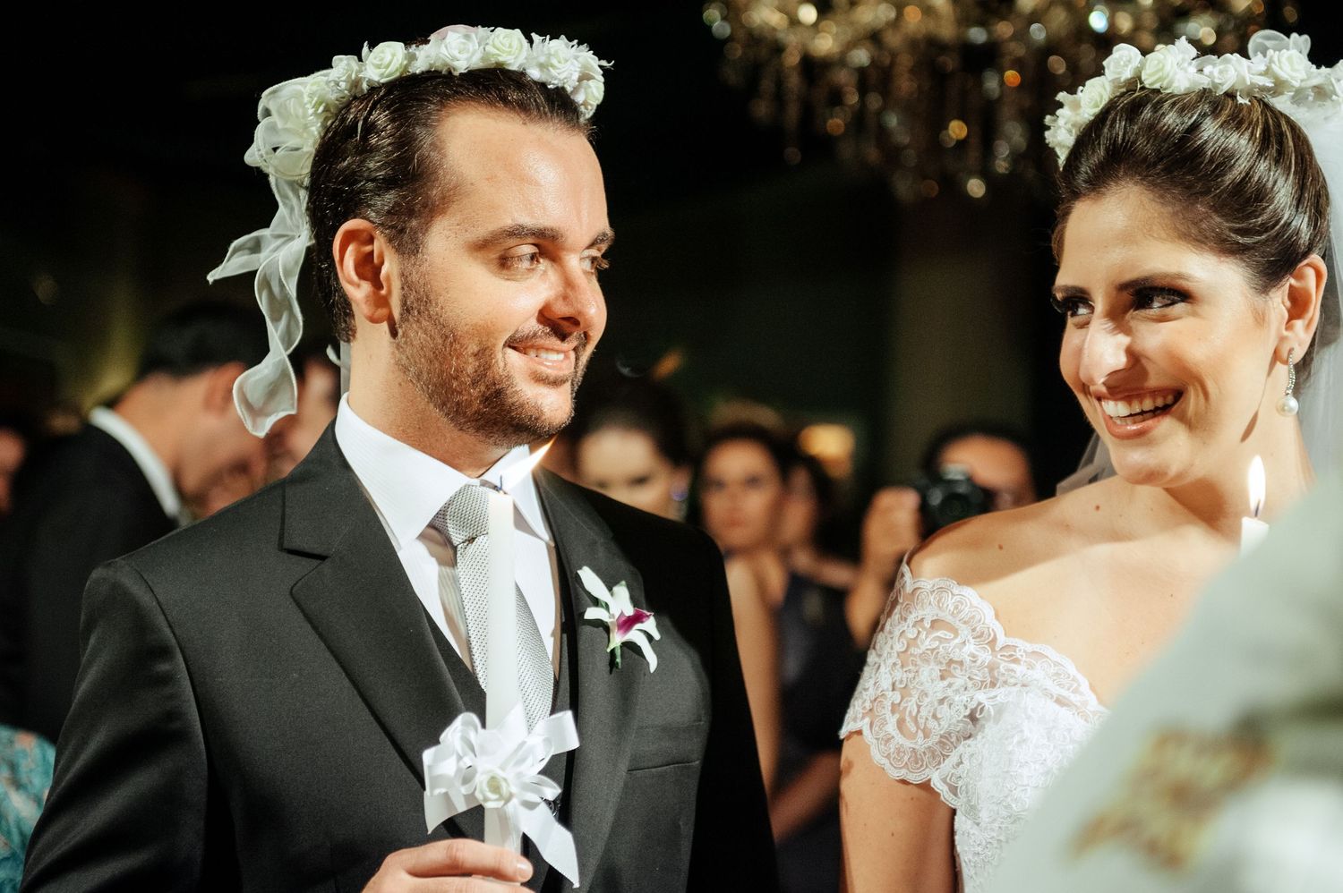 Intimate wedding ceremony moments captured in black and white with soft lighting and romantic expressions.