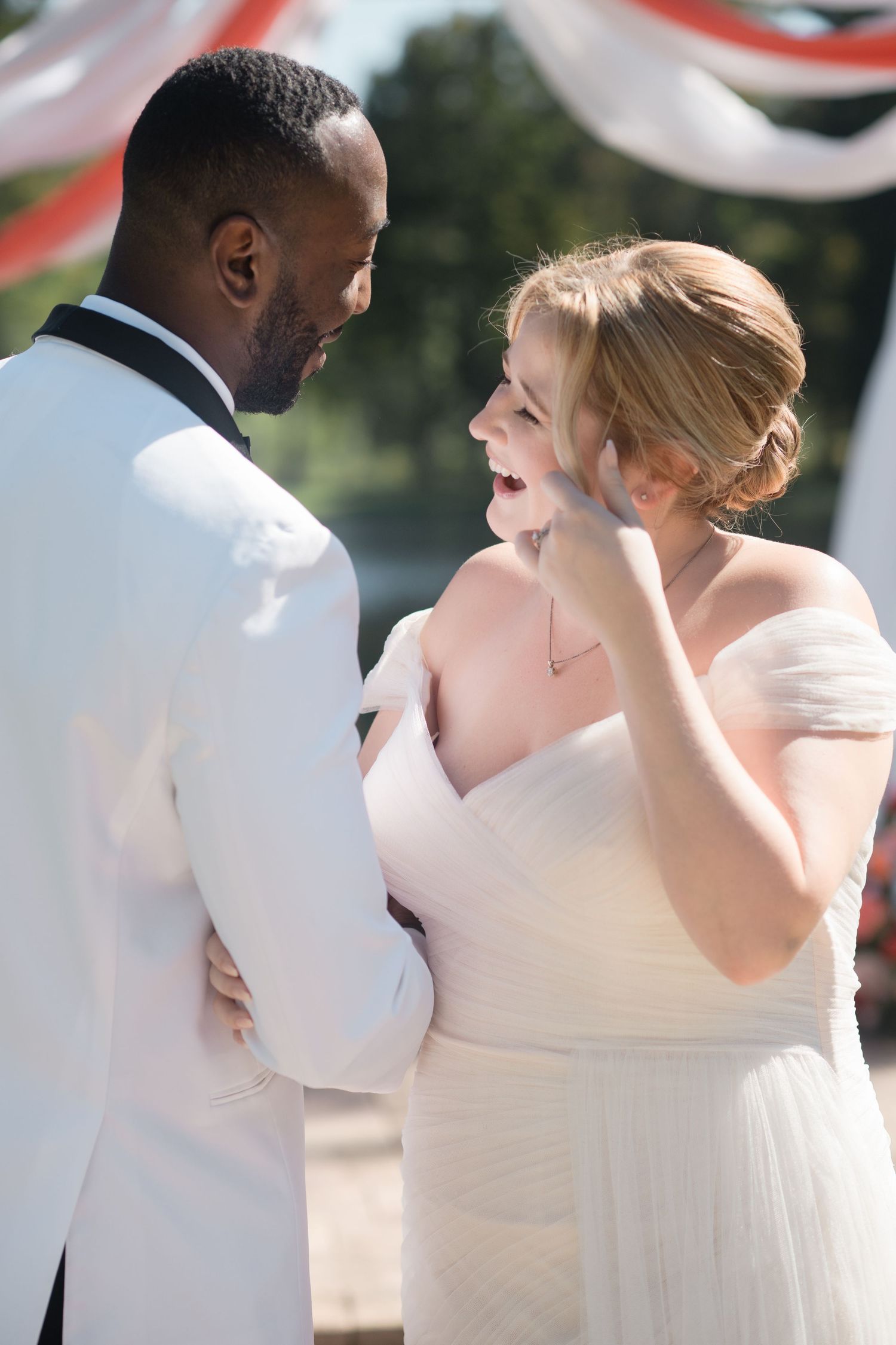 Intimate wedding portrait showing tender moments between the newlyweds.