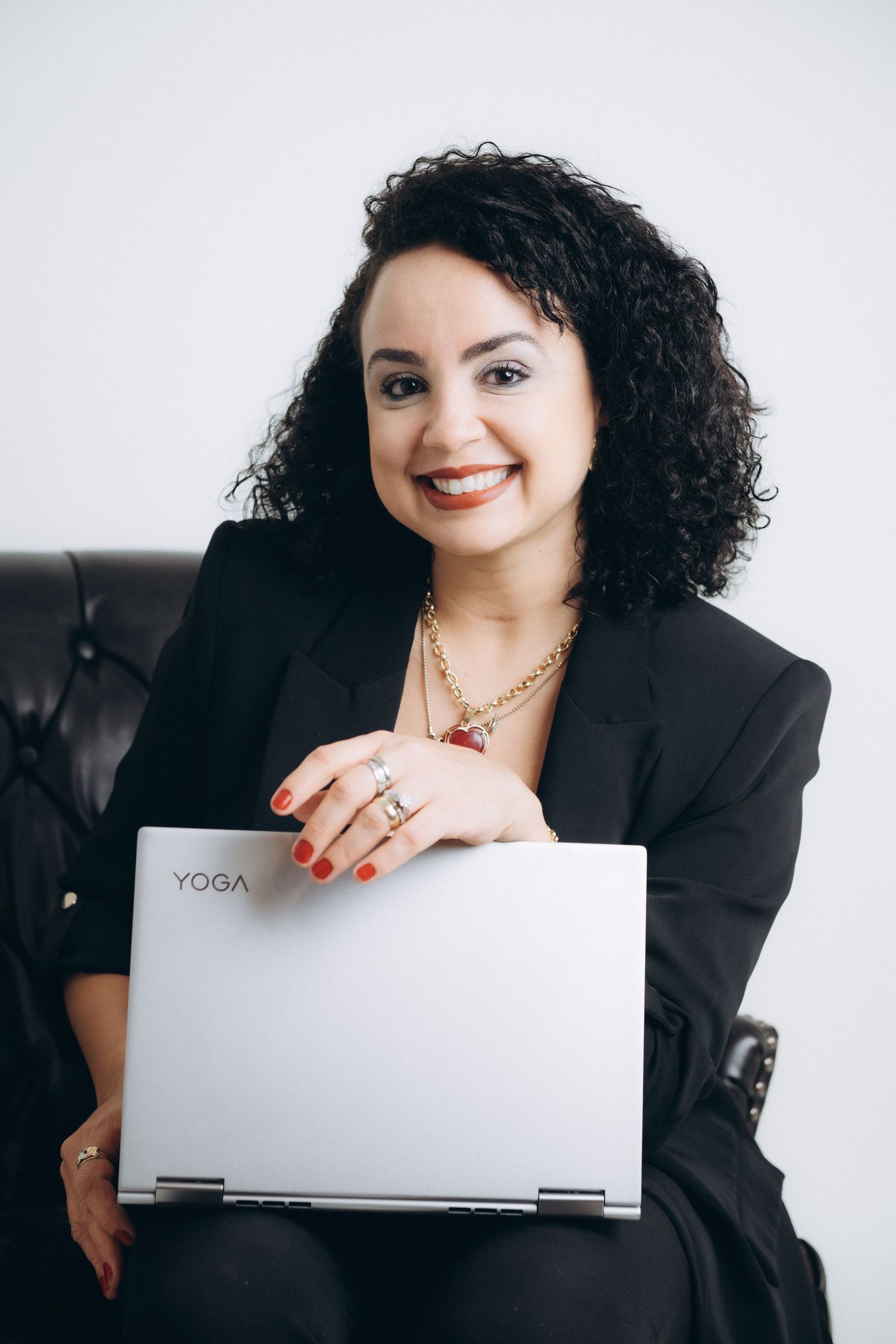 Business portraits with laptop showing professional technology branding.