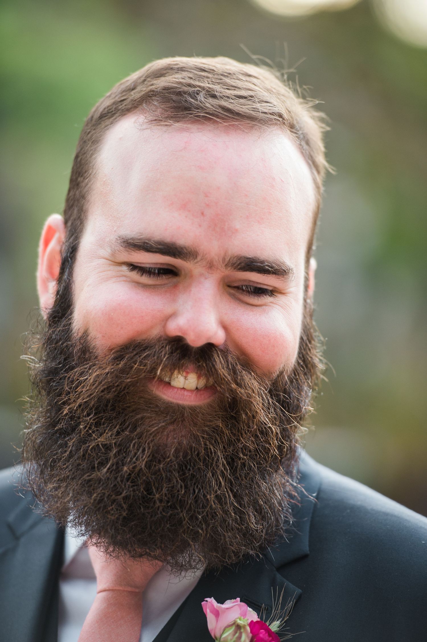A groom with a full beard smiles joyfully in a sequence of candid wedding photos.