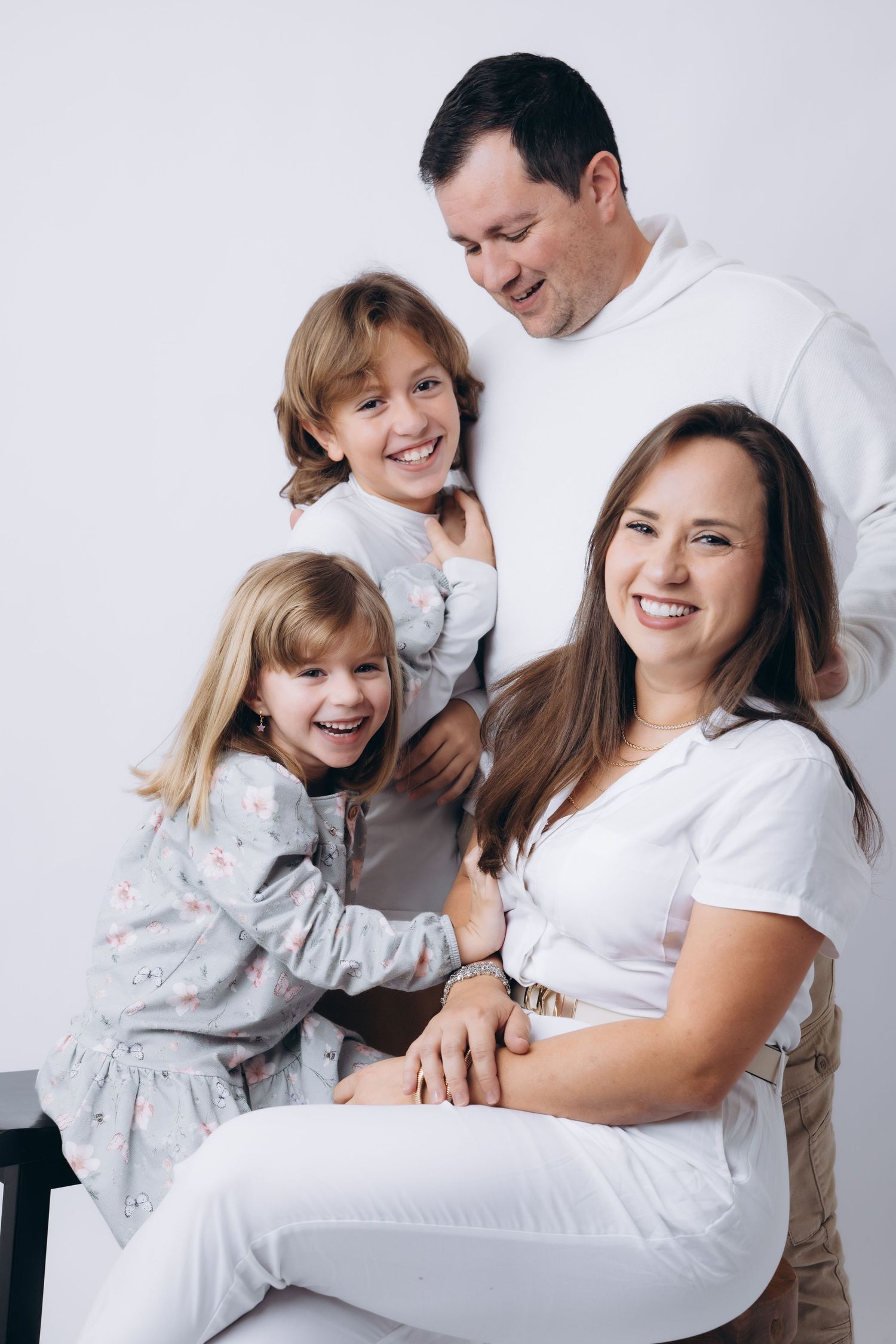 Candid family photos showing joyful interactions on white background.