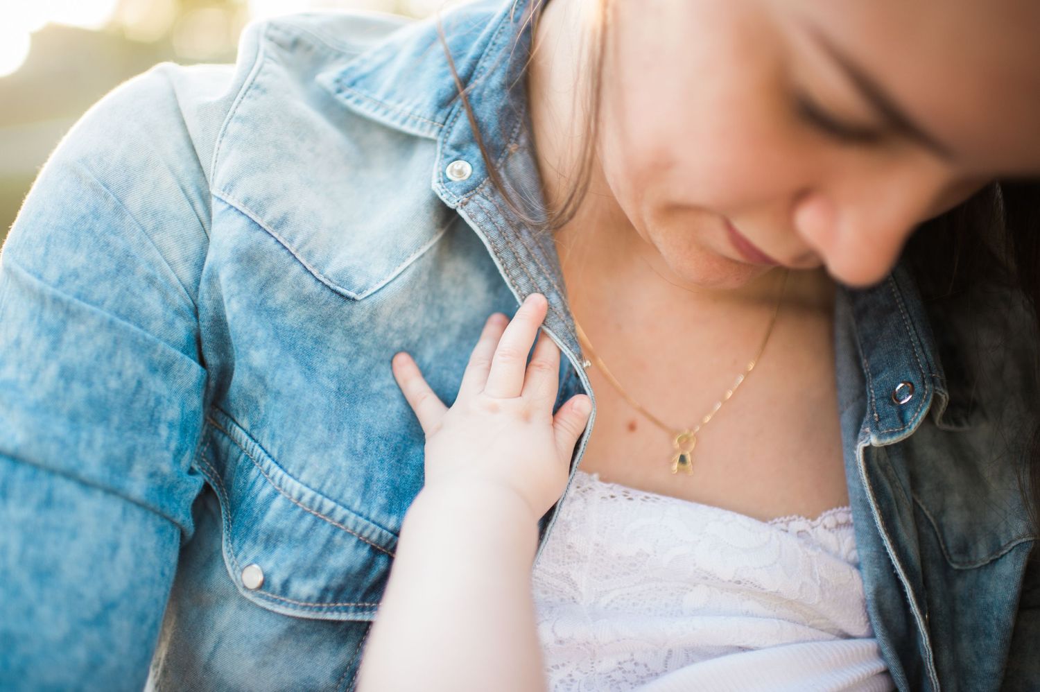 Gentle nurturing moment captured in soft natural lighting.