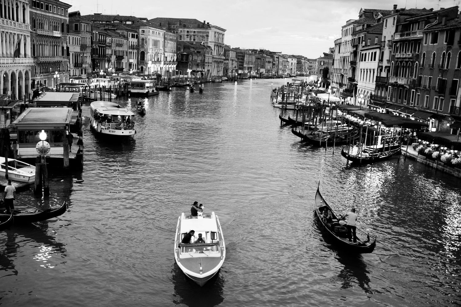 A series of scenic photos showing boats and waterways along Venice's iconic Grand Canal.