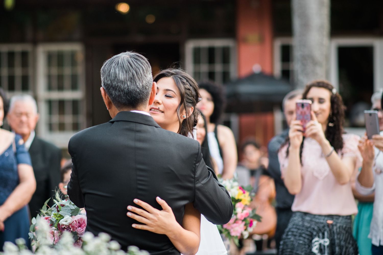 Candid wedding ceremony moments with guests reacting emotionally.