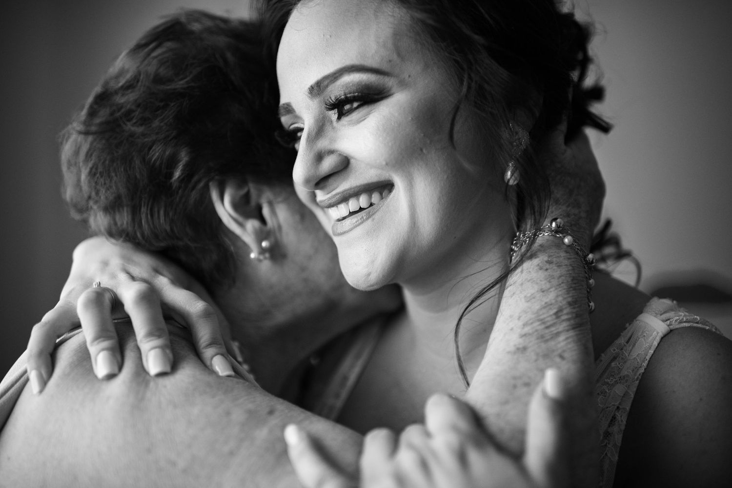 Black and white close-up shots capturing tender wedding moments.