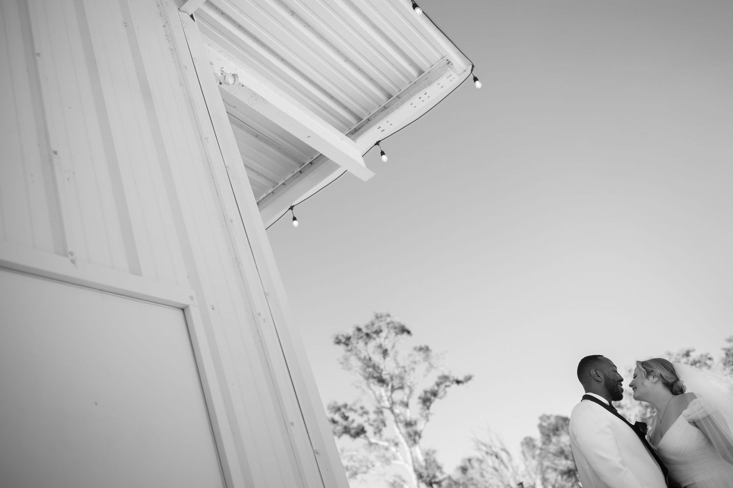 White architectural details of a building interior with geometric lines and patterns.