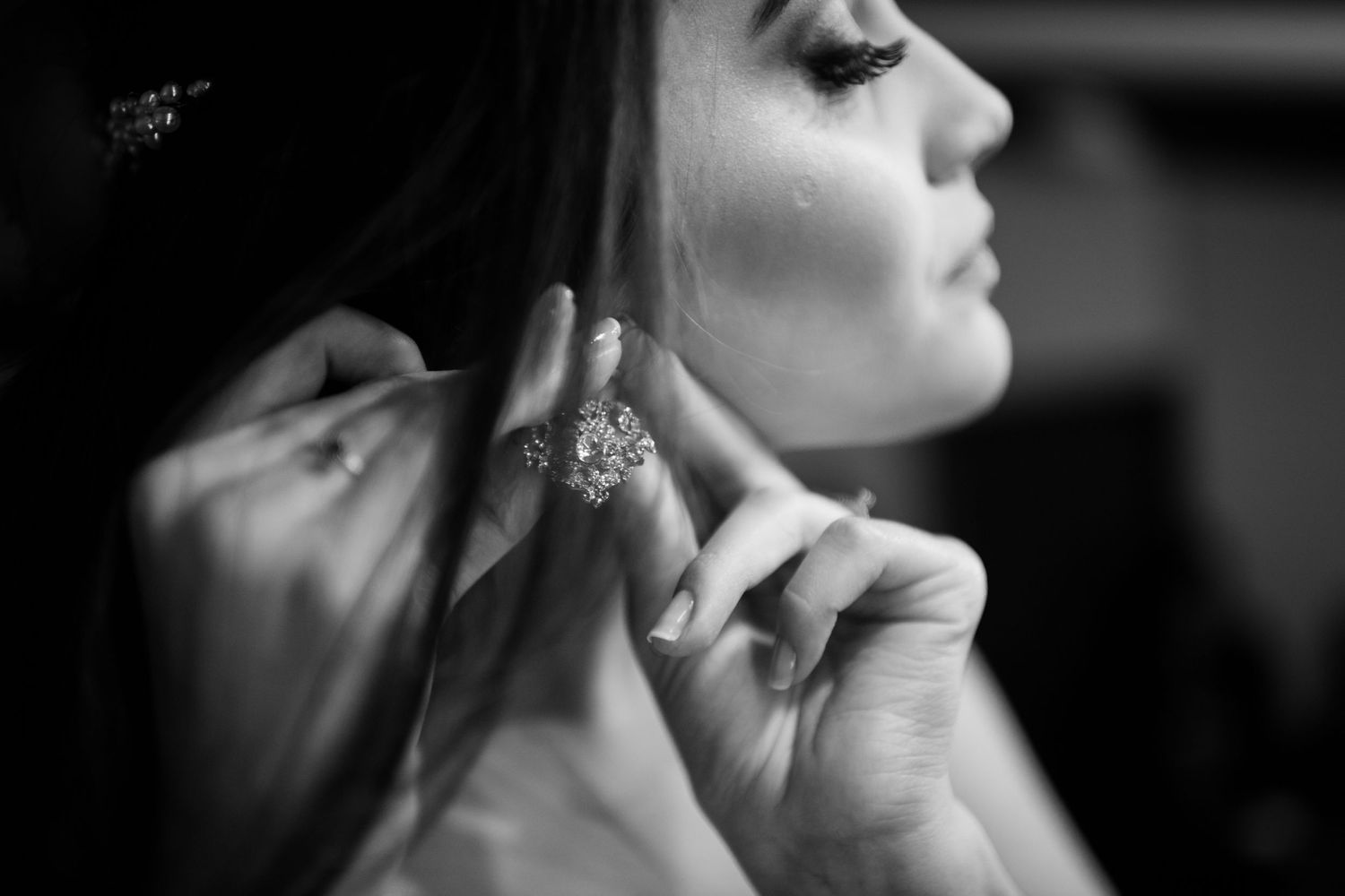 Dramatic black and white profile portrait with soft lighting.