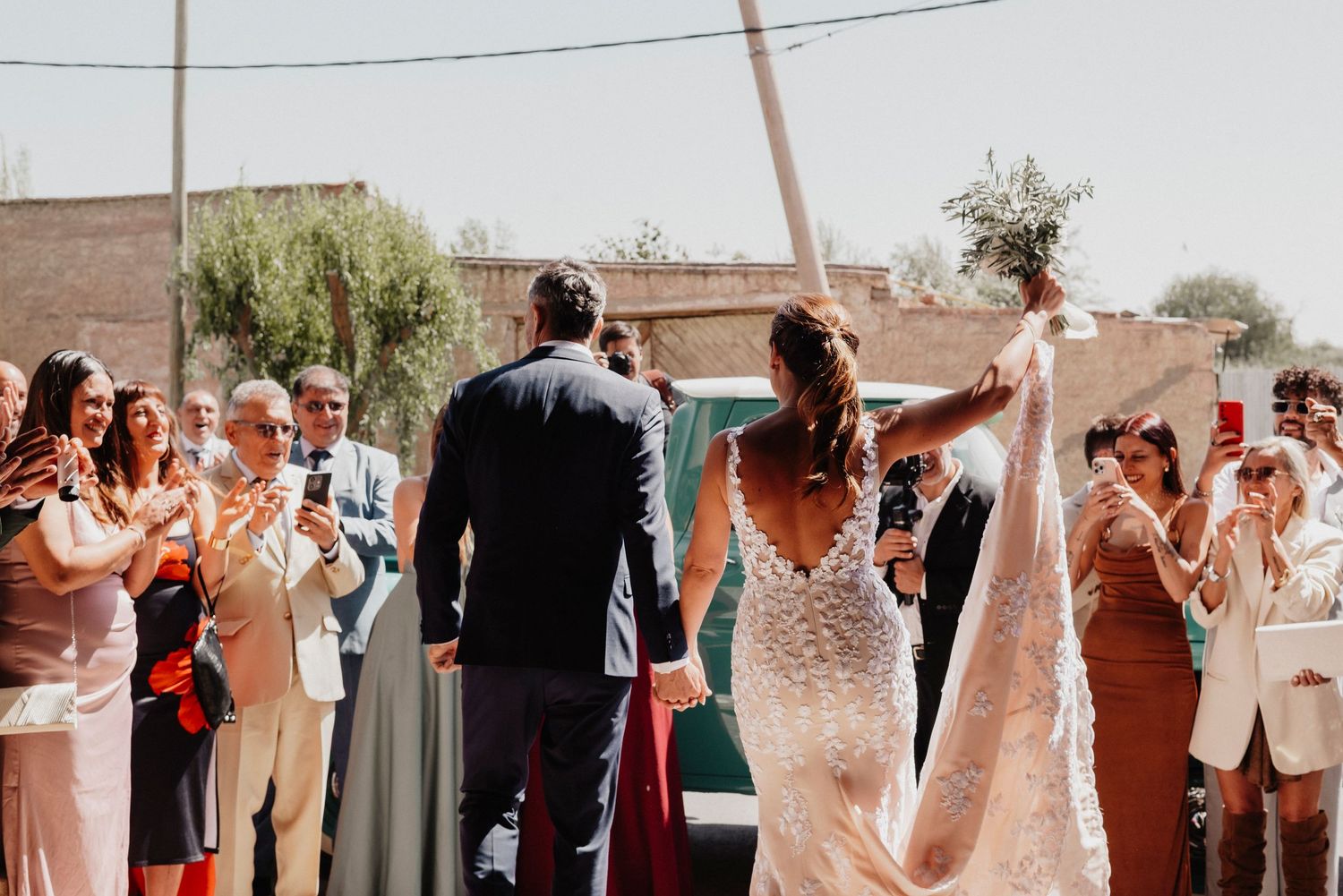 A collage of candid wedding reception moments showing dancing and celebrations at an outdoor venue.