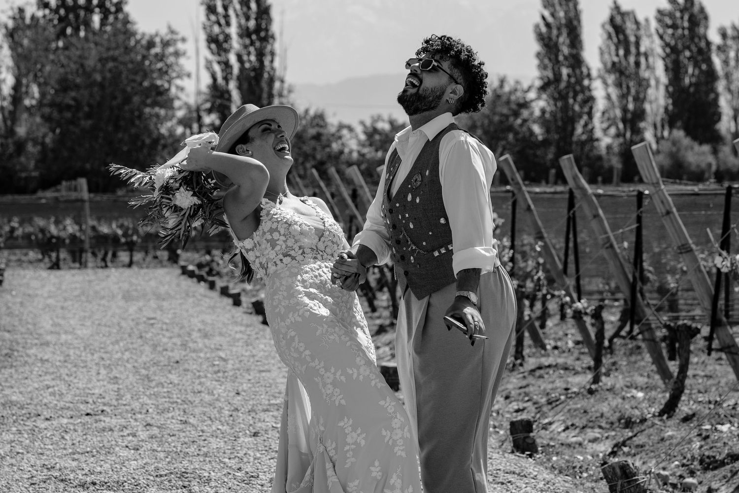 Black and white photo series showing vineyard workers harvesting grapes in a traditional wine growing region.