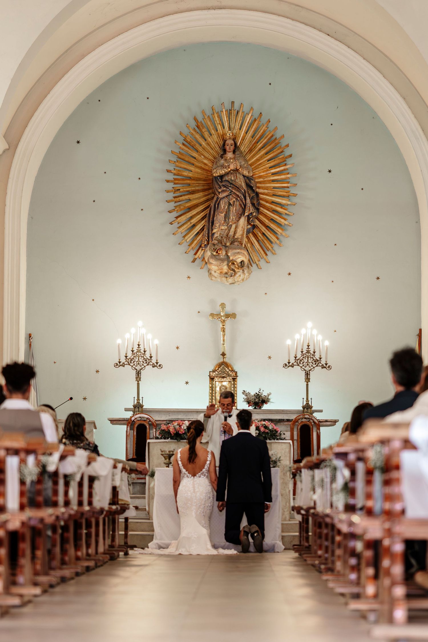 A series of four photos showing a traditional church wedding ceremony from different angles in a white arched sanctuary.