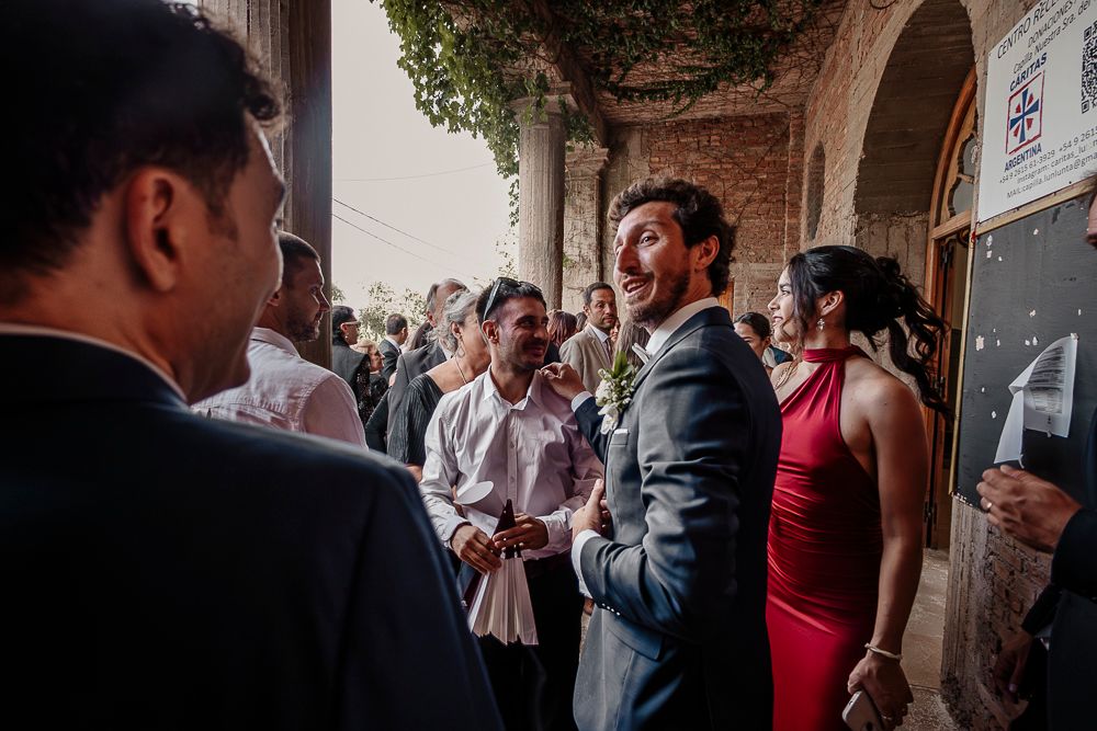 A group of people gather and socialize at what appears to be an indoor reception or networking event. wedding in mendoza