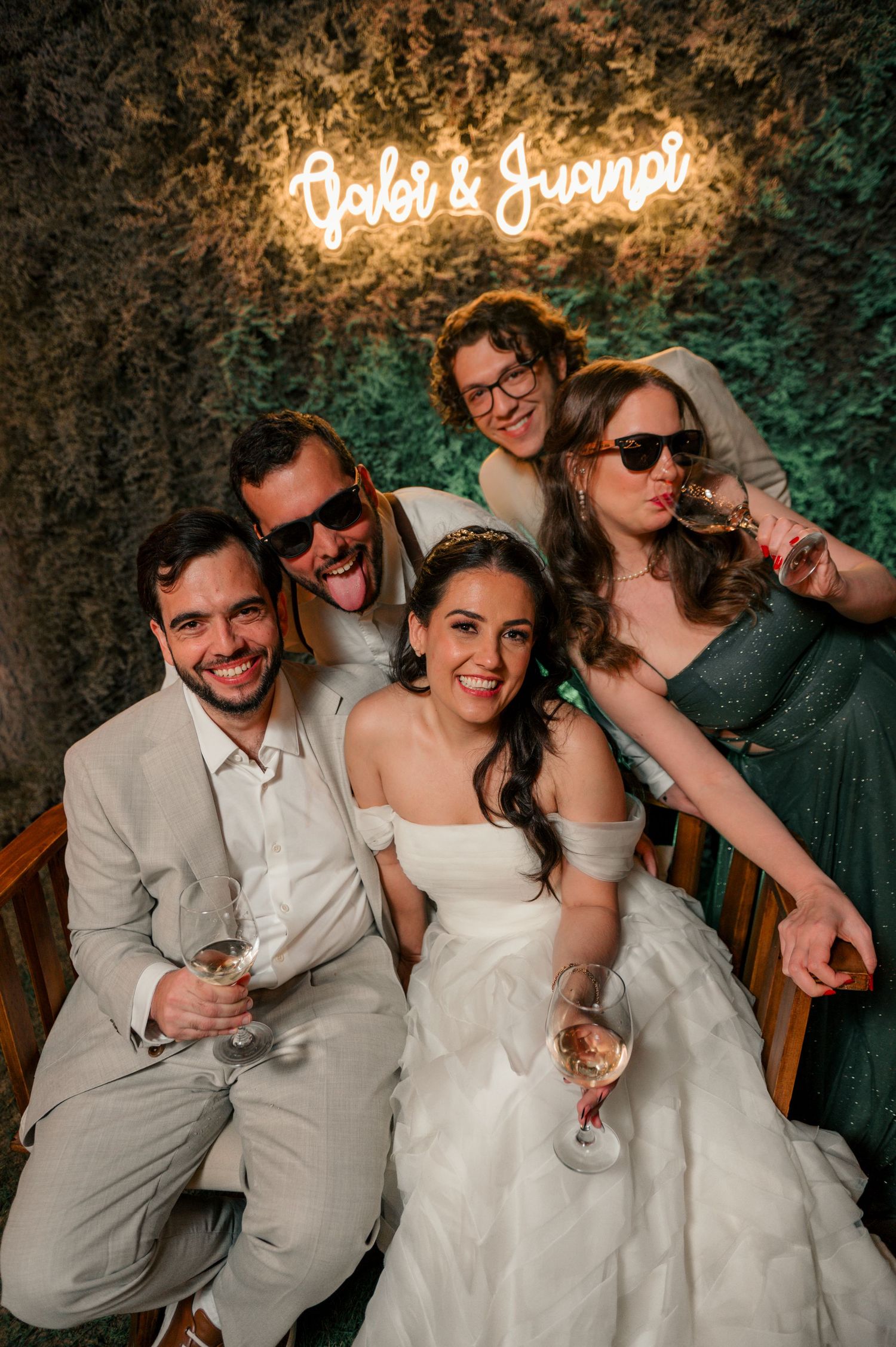 A sequence of wedding party photos showing guests laughing and celebrating together in a festive setting.