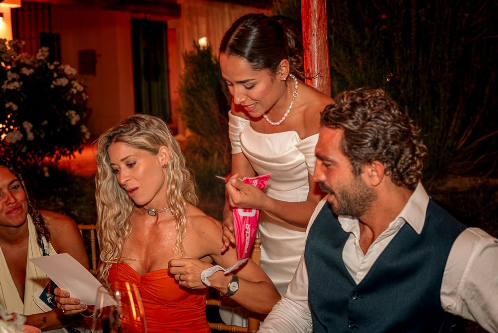 People dancing and celebrating at a festive party with warm lighting and joyful atmosphere. wedding in mendoza