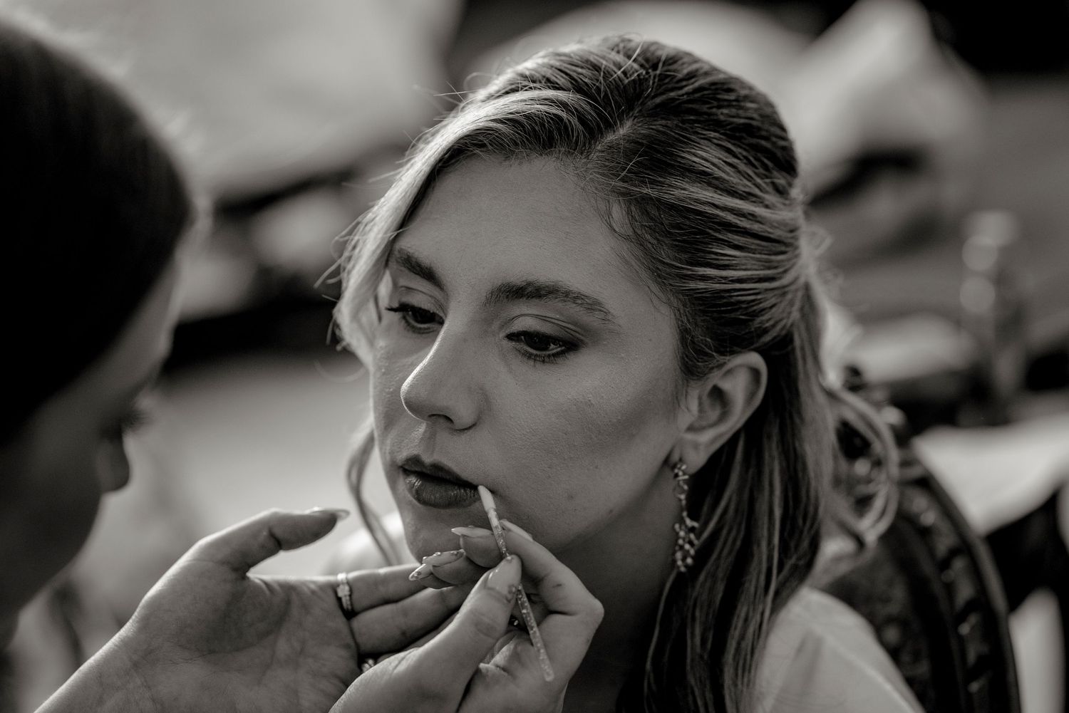 A series of black and white close-up photographs showing emotional expressions and intimate moments.