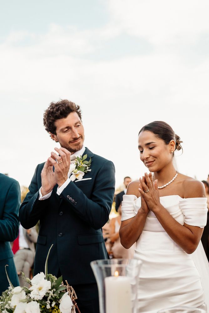 Emotional wedding moment captured as couple wipes tears during outdoor ceremony. wedding in mendoza