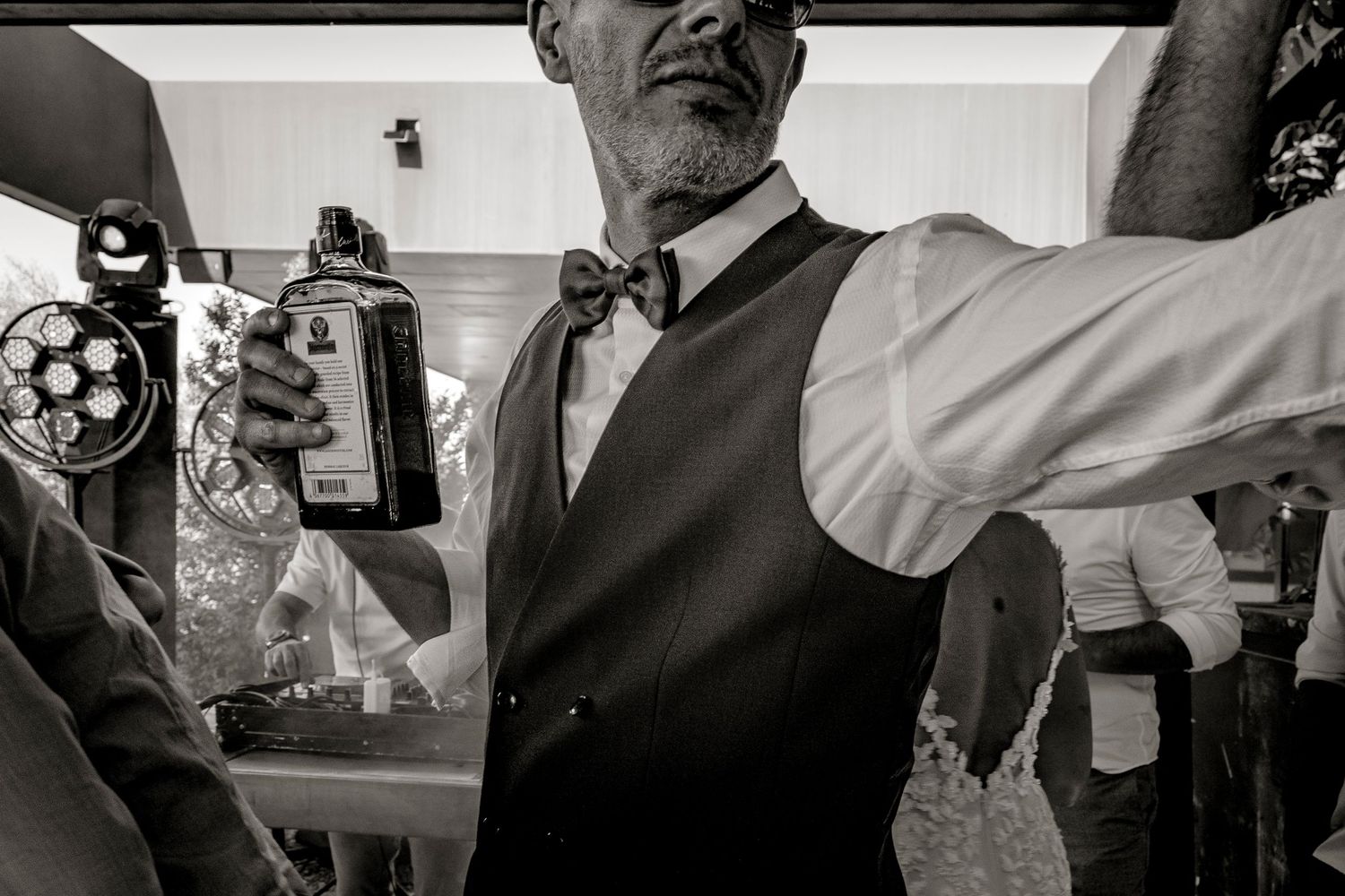 A black and white photo showing a couple during an intimate first dance at their wedding reception.