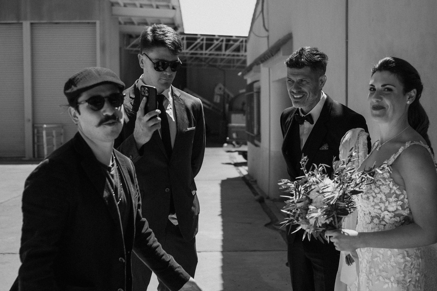 A collection of vintage black and white wedding photographs displayed in a horizontal collage format.