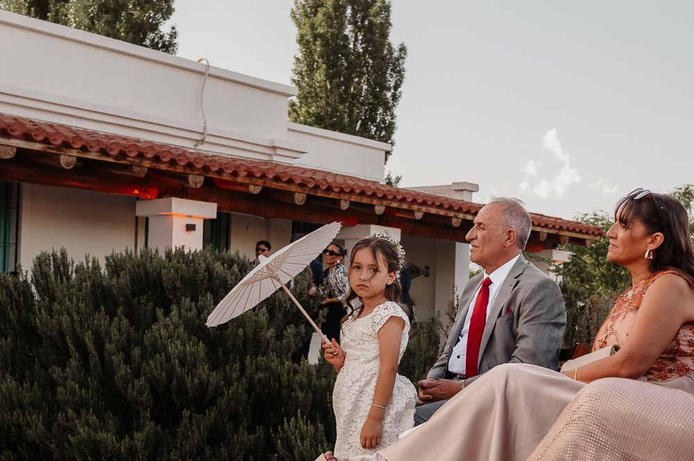 Wedding guests enjoy drinks and conversation during an outdoor reception celebration. wedding in mendoza