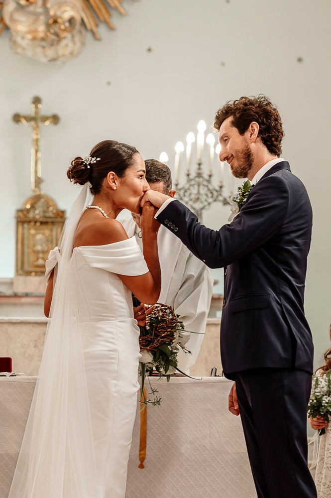 A couple shares a romantic first dance moment in a church setting with elegant decor and soft lighting. wedding in mendoza