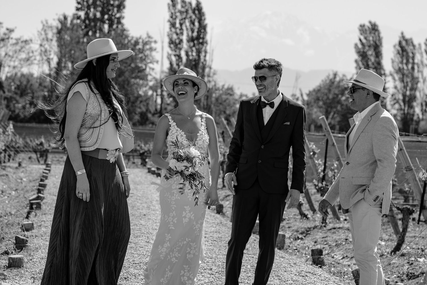 Vintage black and white photos showing people walking and gathering outdoors in a park-like setting.