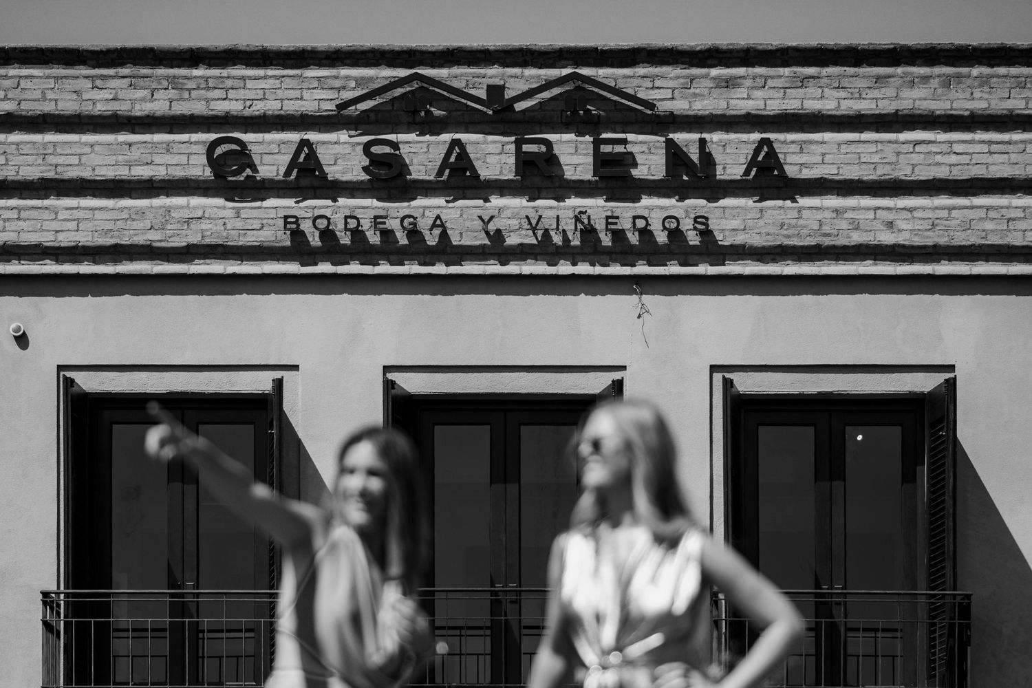 A black and white storefront view of a vintage casablanca sign on a building exterior.