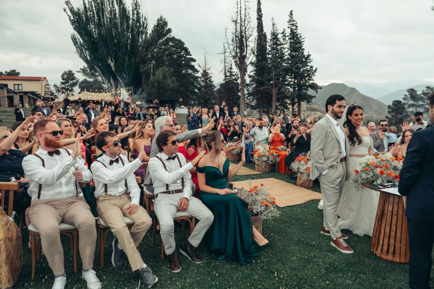 Wedding guests dance and celebrate together outdoors during a joyful reception celebration. fotografos de boda en mendoza