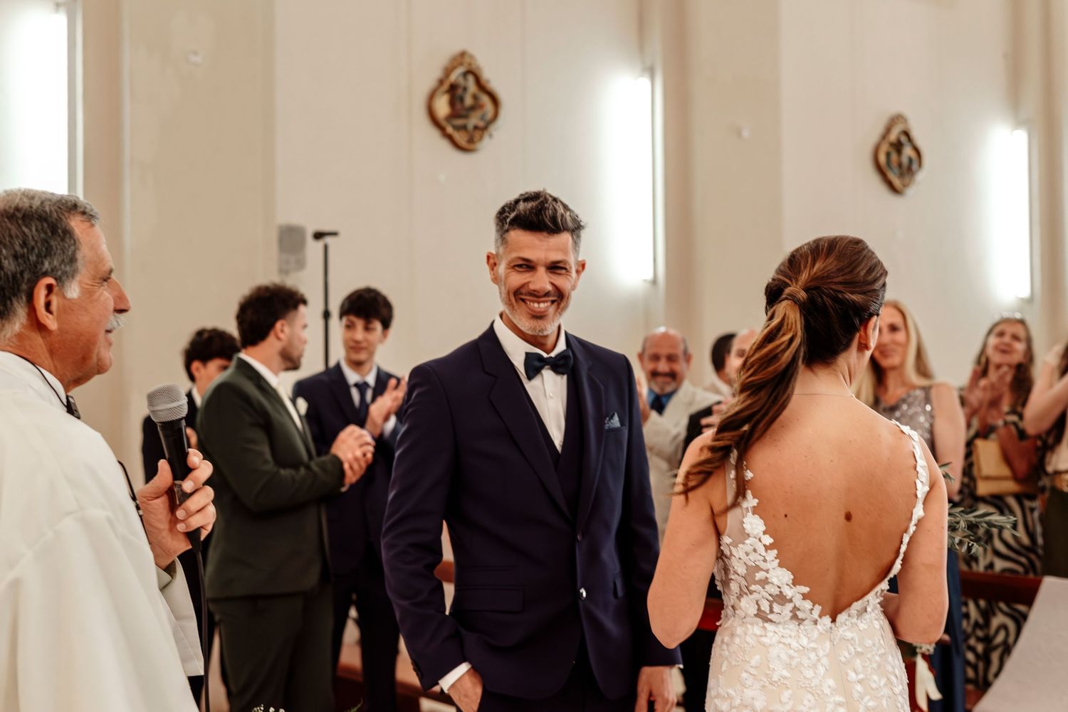 Wedding guests dancing and celebrating on a dance floor during an elegant reception party.