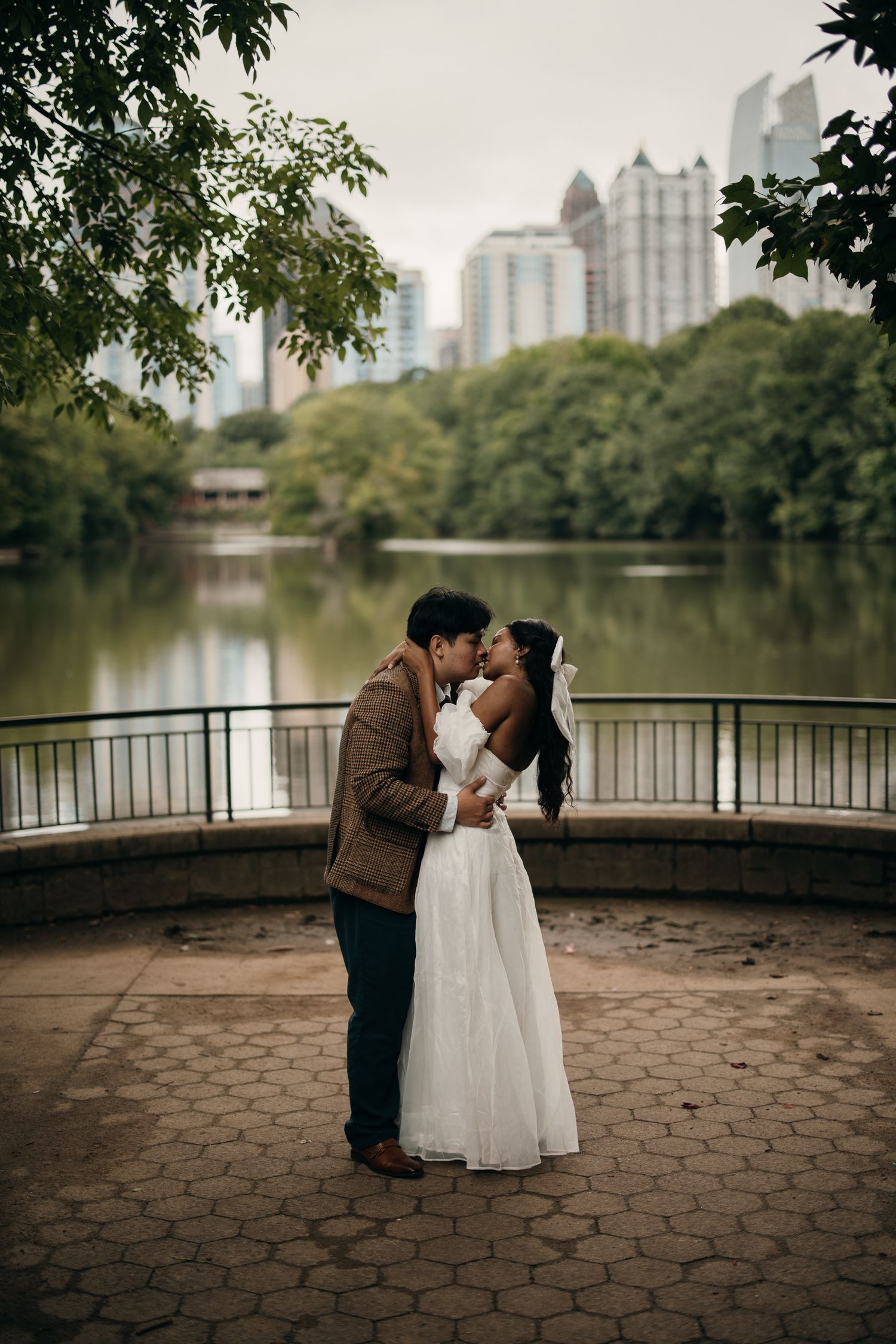 Piedmont Park elopement portrait with the Midtown Atlanta skyline in the background.