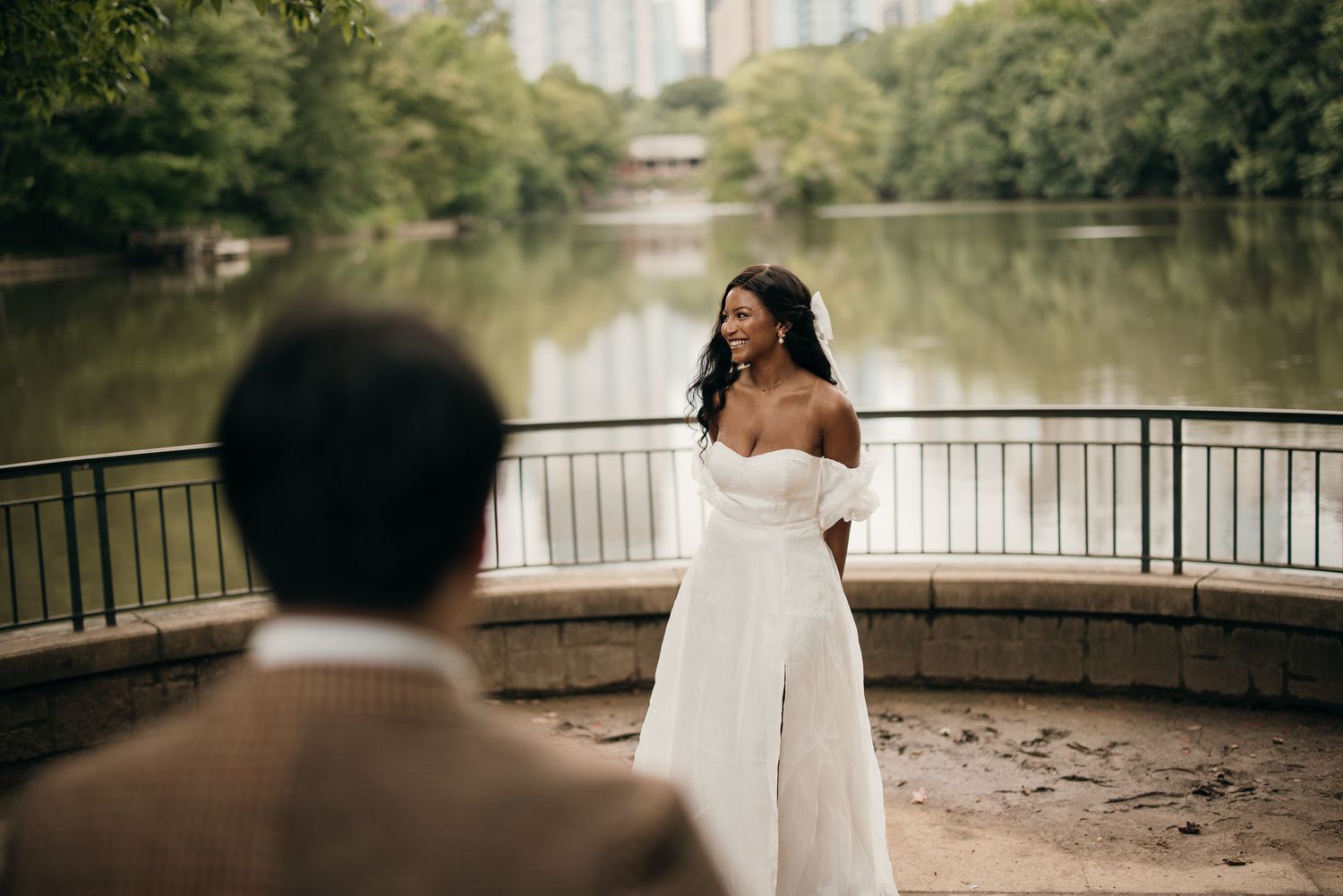 Piedmont Park elopement portrait with the Midtown Atlanta skyline in the background.