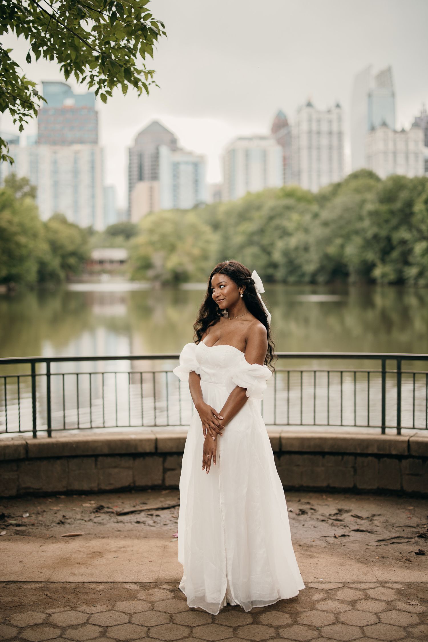 Piedmont Park elopement portrait with the Midtown Atlanta skyline in the background.