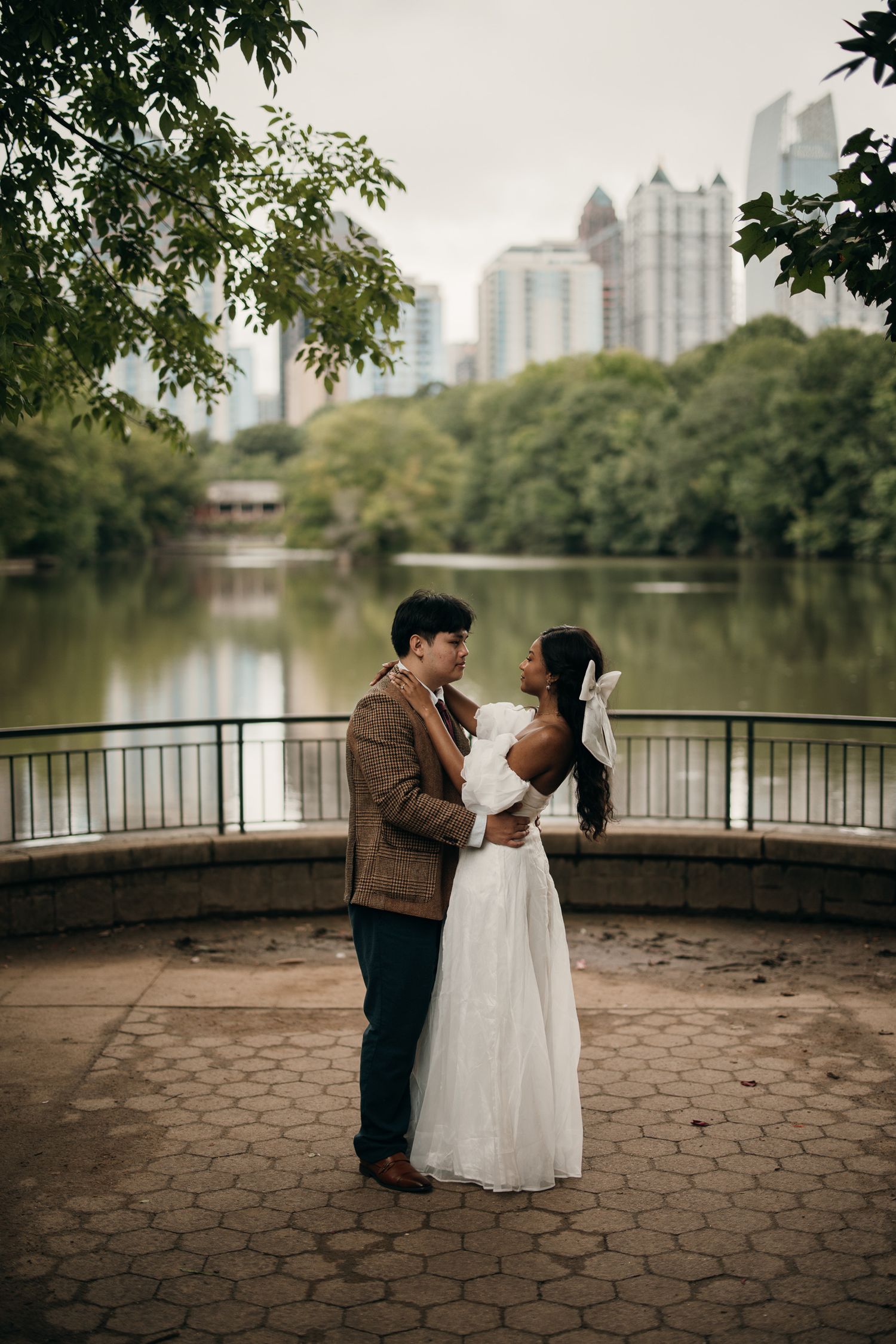 Piedmont Park elopement portrait with the Midtown Atlanta skyline in the background.