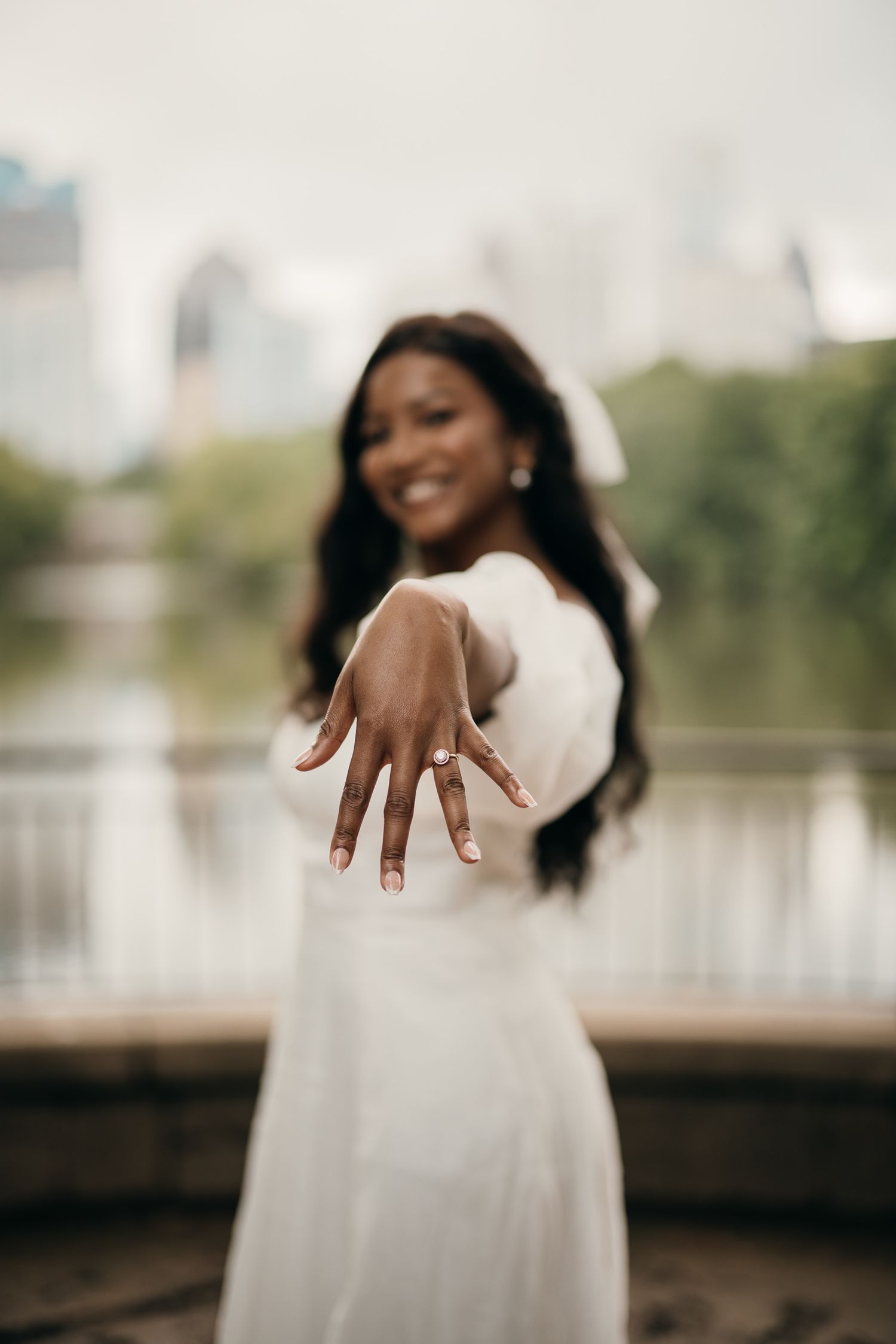 Piedmont Park elopement portrait with the Midtown Atlanta skyline in the background.