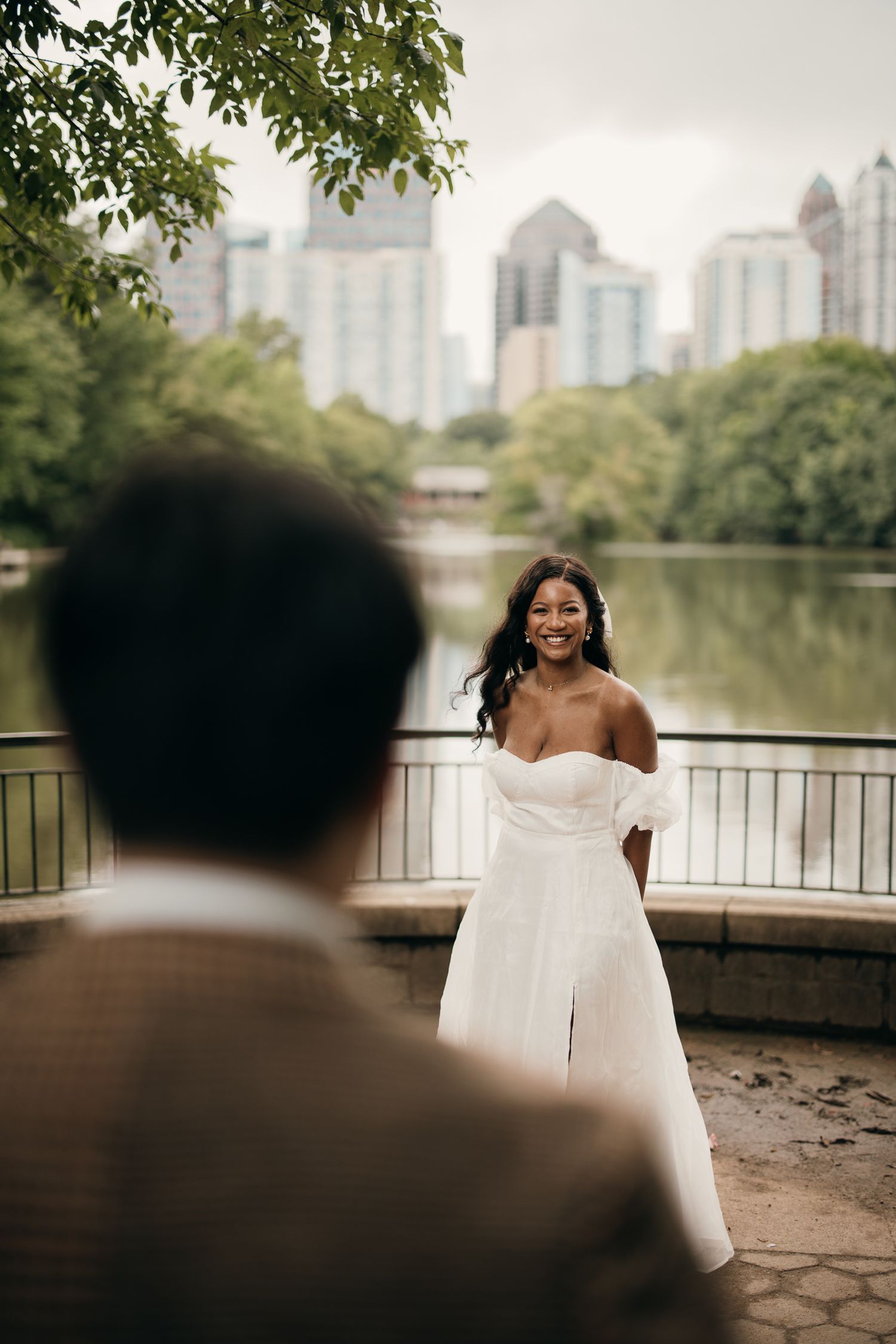 Piedmont Park elopement portrait with the Midtown Atlanta skyline in the background.
