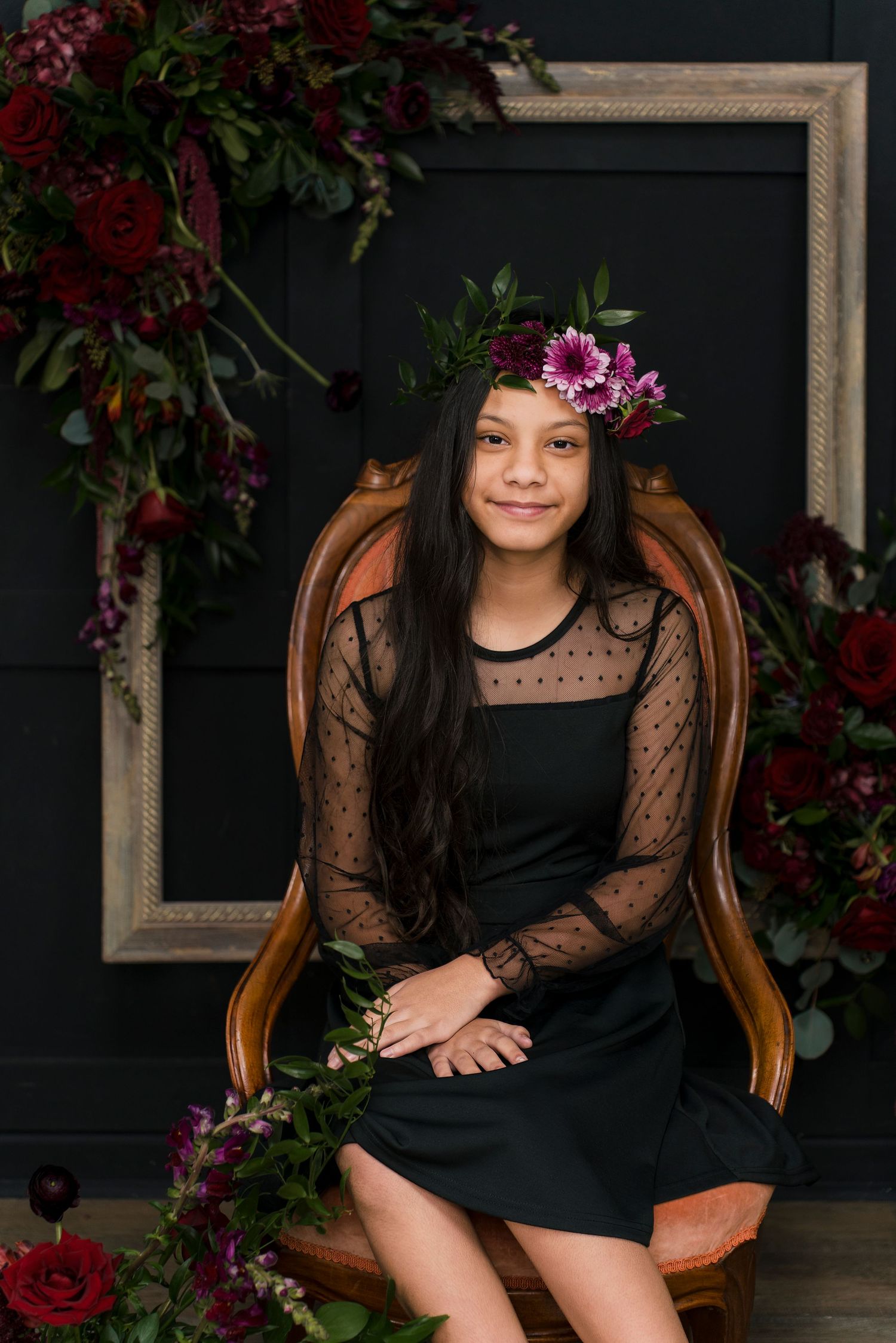 A series of elegant portrait photos featuring a black dress against a dark backdrop with red and purple floral accents.
