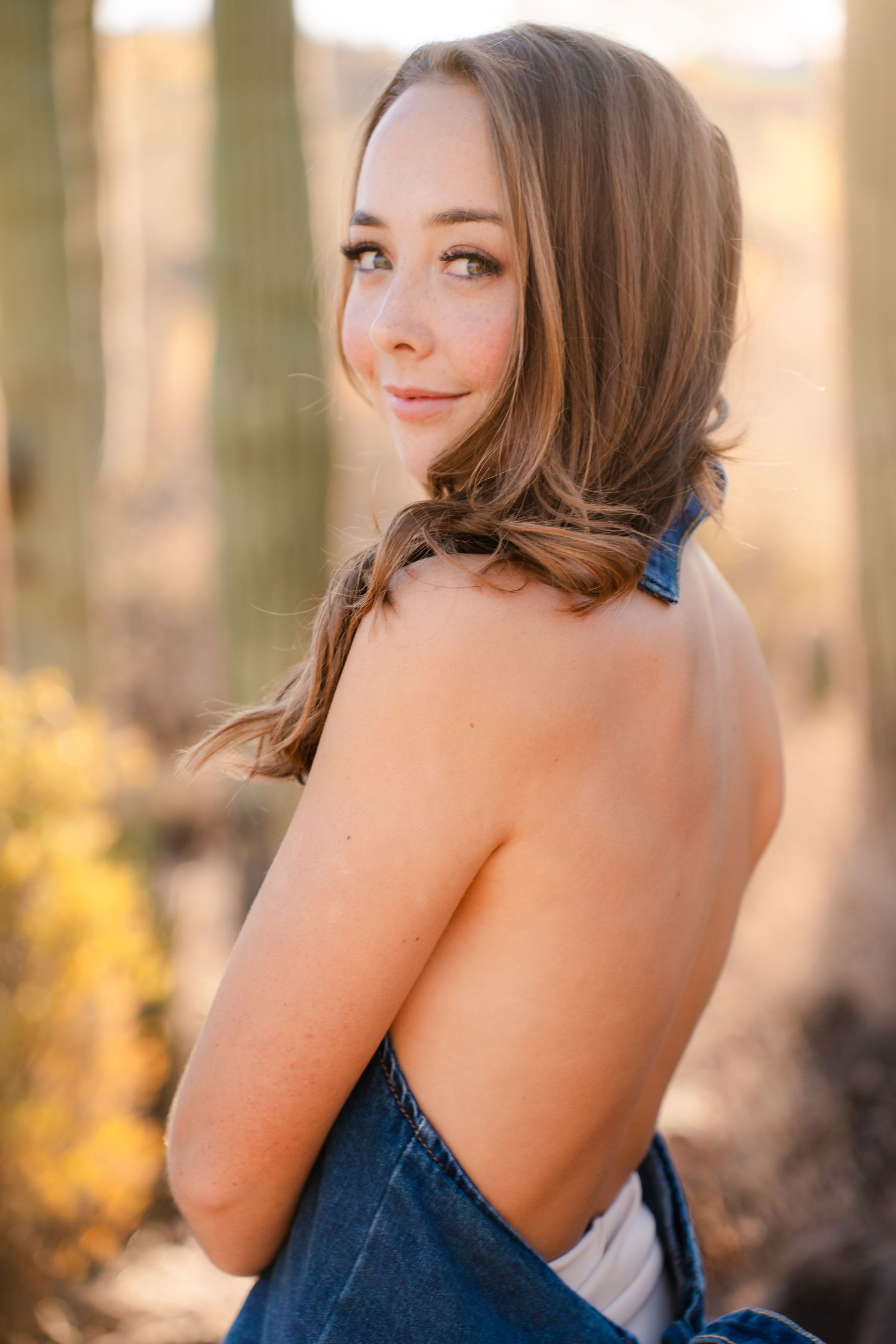 Desert sunset graduation portrait with natural backlighting.