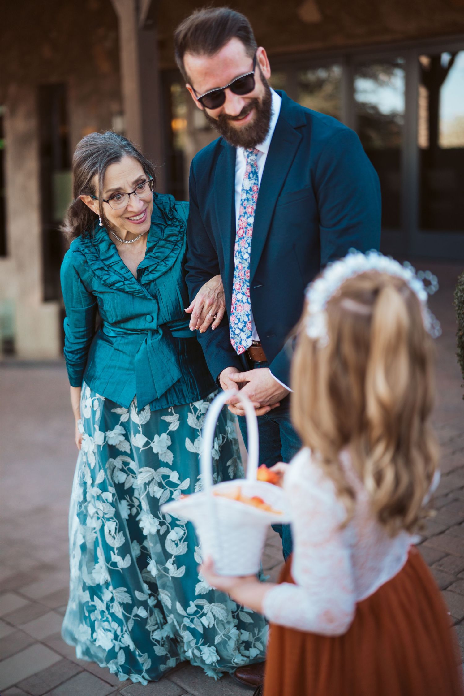 Casual outdoor family interactions between adults and children.