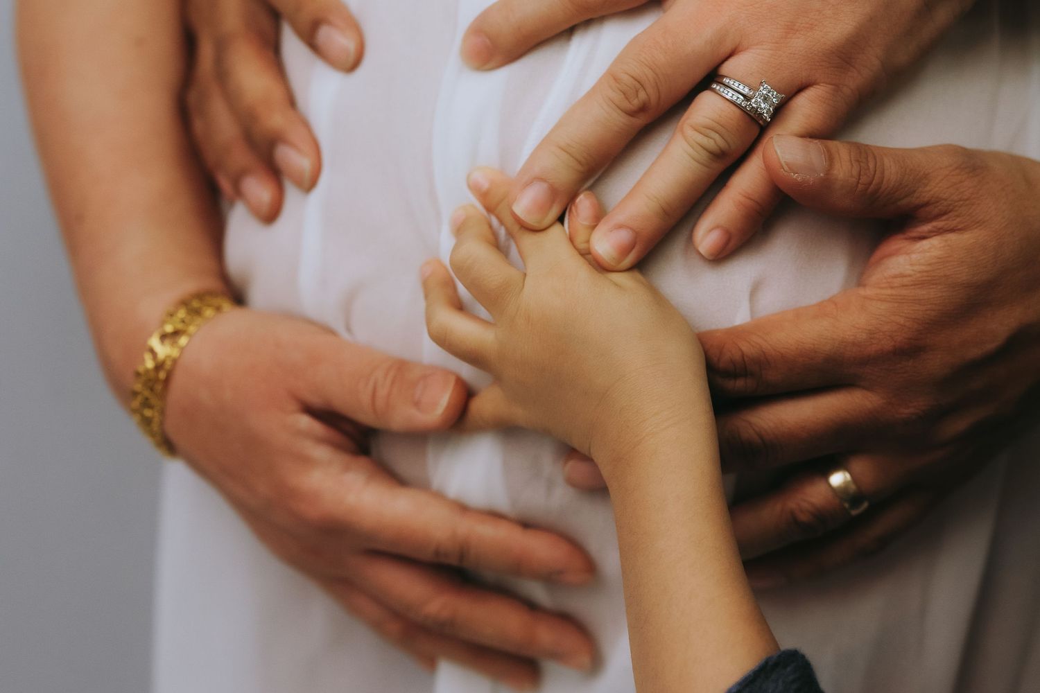 Close-up of hands performing traditional massage therapy techniques targeting pressure points and muscles.
